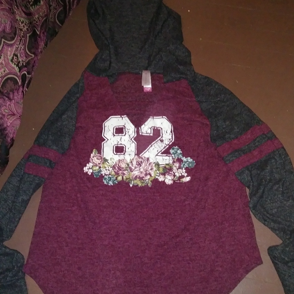 A long sleeve shirt with hood